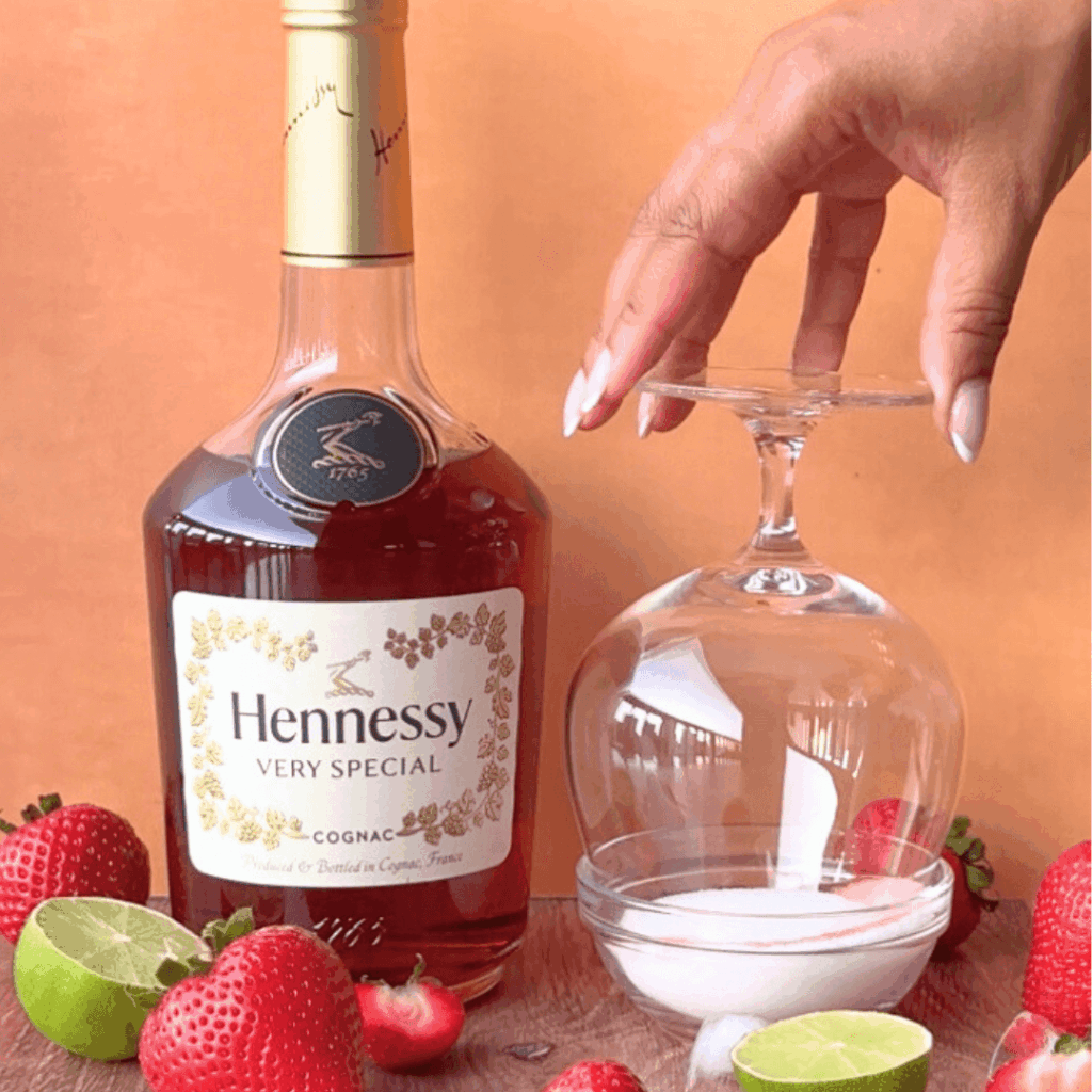 Step 1 Photo of rimming the glass for a strawberry Hennessy margarita