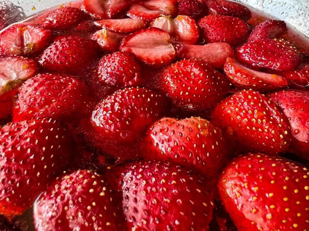 close up photo of strawberries in syrup