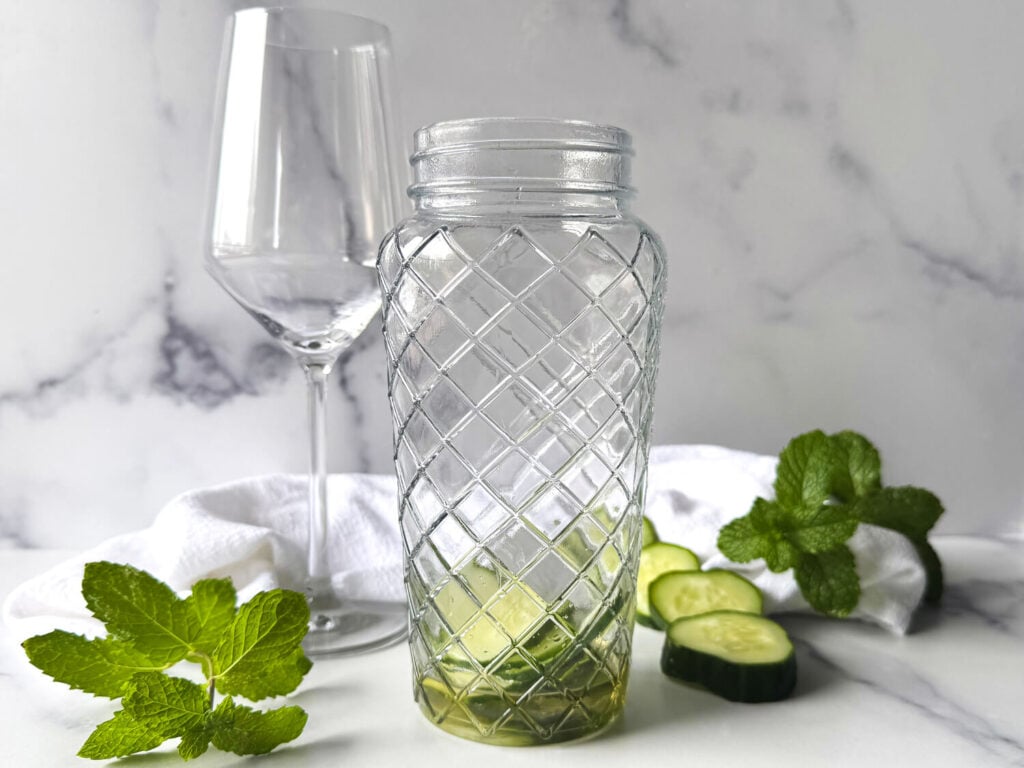 photo of ingredients in cocktail glass before muddling