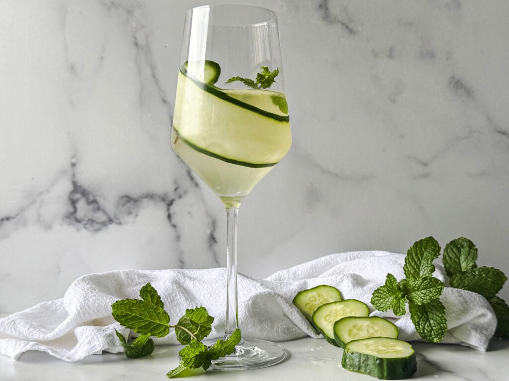 photo of a cucumber spritz in a wine glass