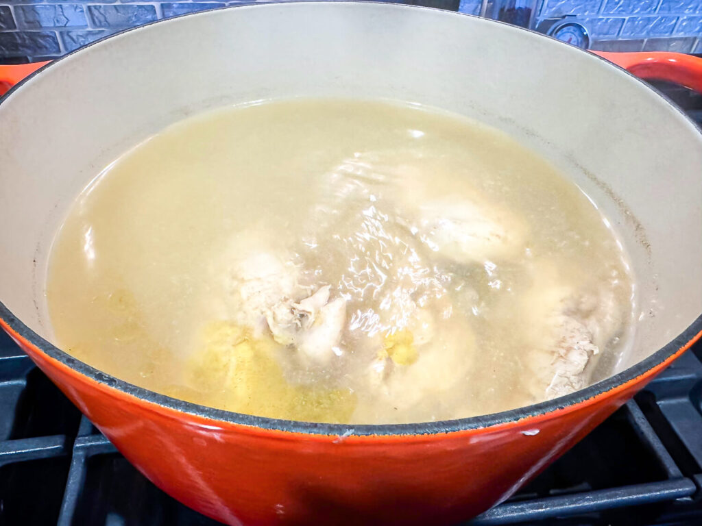 photo of chicken boiling to make homemade chicken broth
