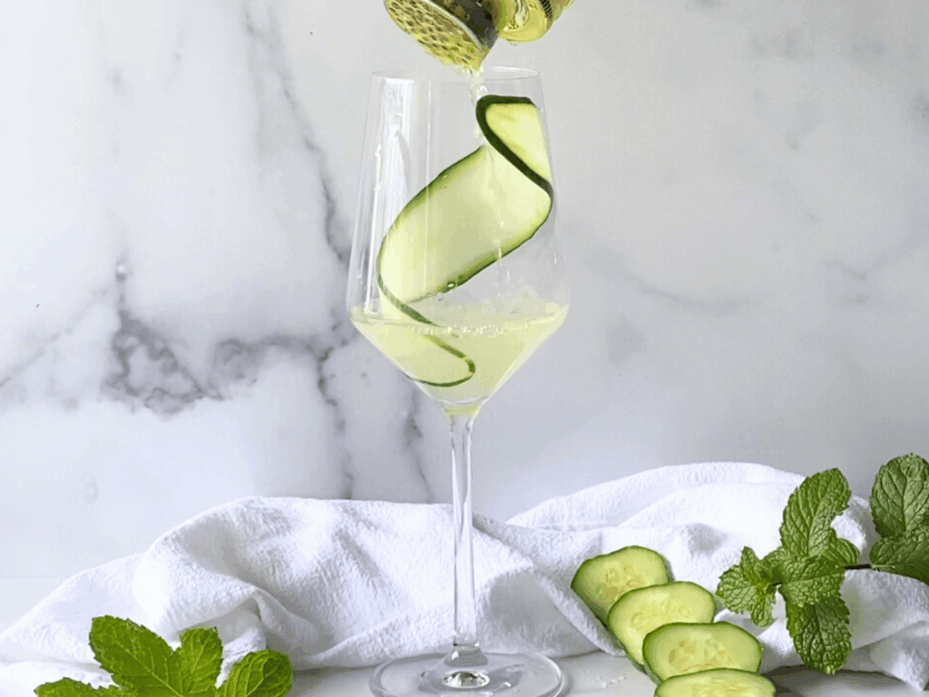 photo of cocktail mix being strained in a glass