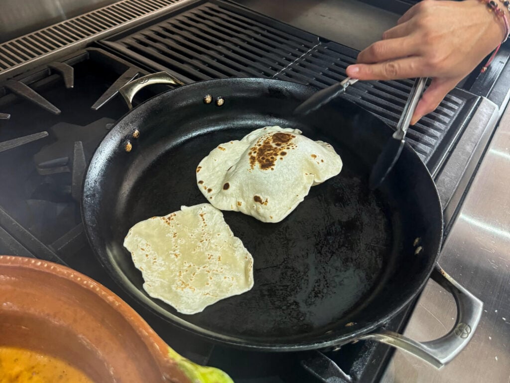photo of cooking flour tortillas in a pan in Mexico