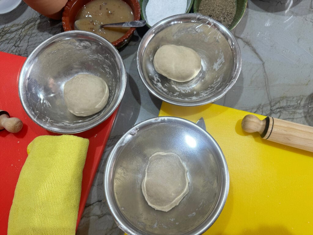 photo of tortilla dough from recipe in metal bowls