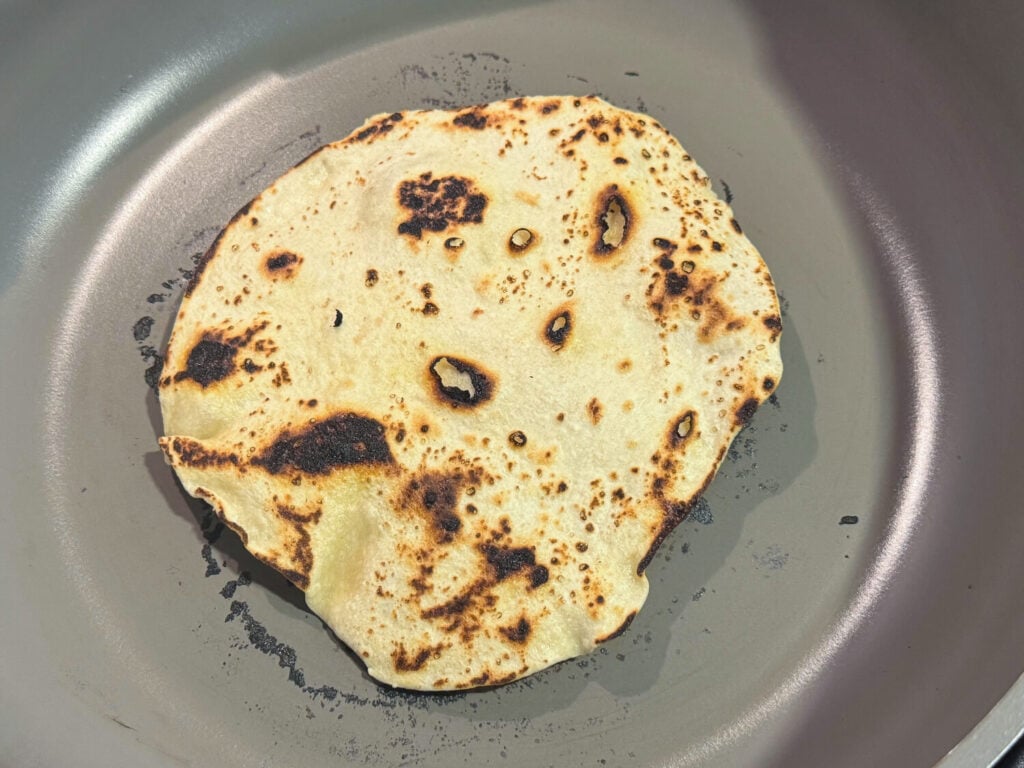 photo of cooking flour tortilla in a pan