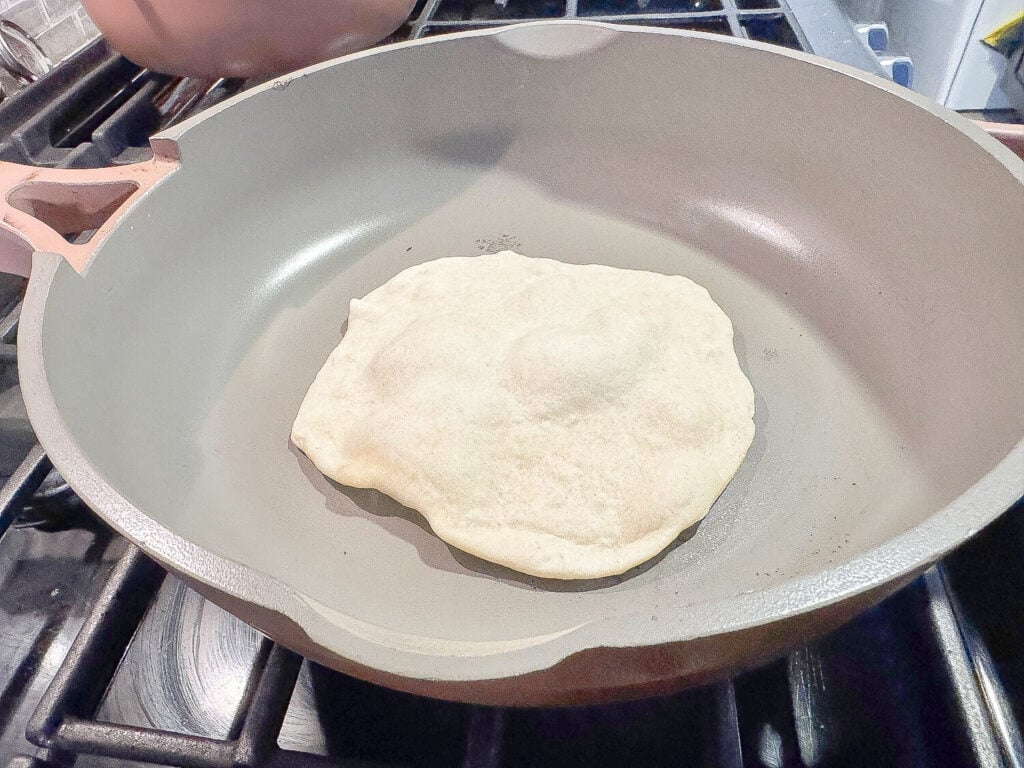 photo of cooking flour tortilla in a non-stick pan