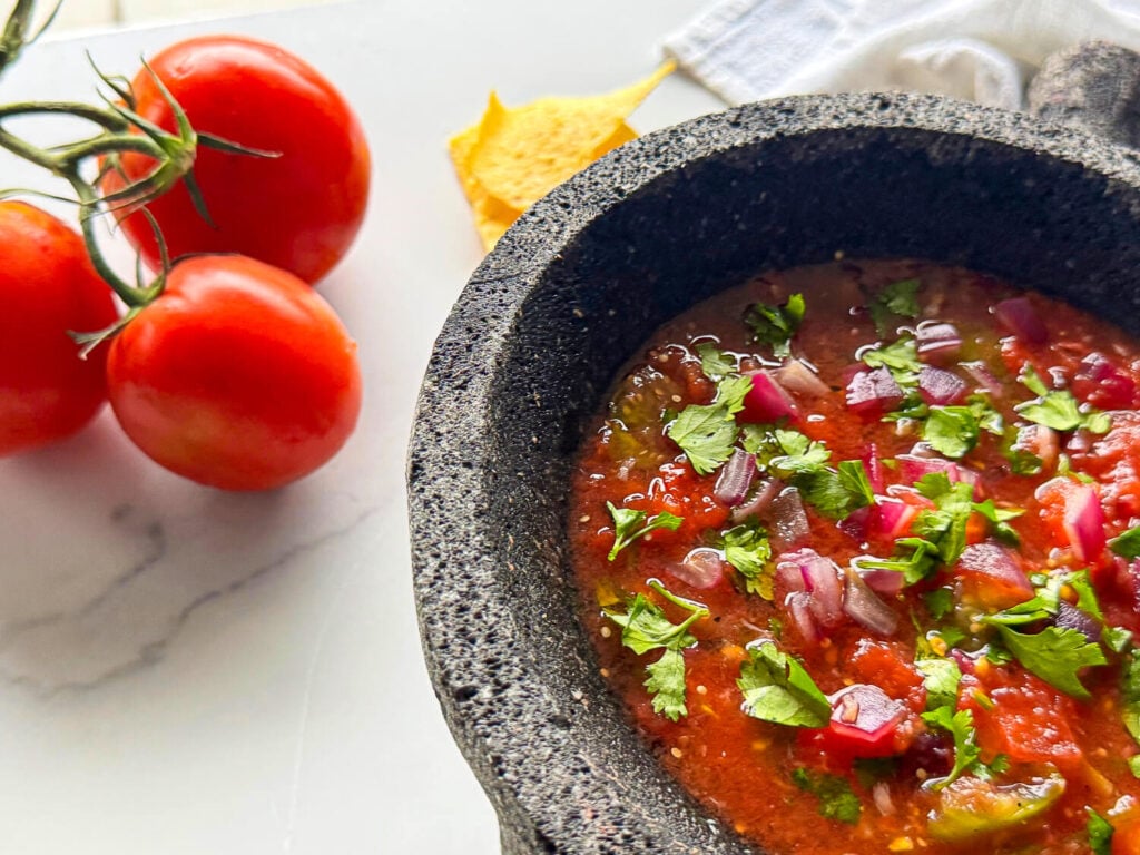 photo of salsa recipe next to tomatoes
