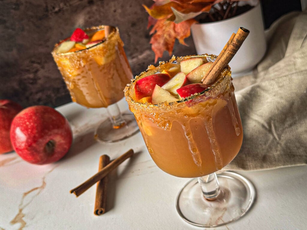 overhead shot of apple cider sangria with a cinnamon stick