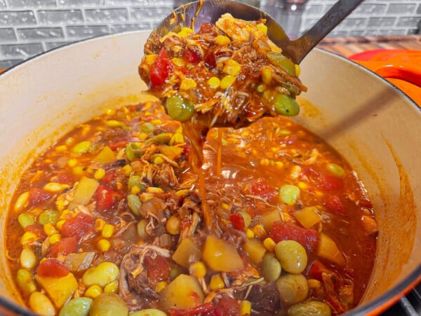 Brunswick Stew falling out of a spoon