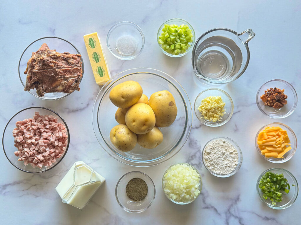 photo of all ingredients needed for ham and potato soup on a marble table