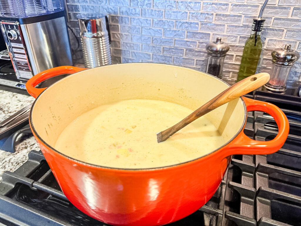 photo of ham and potato soup in a dutch oven