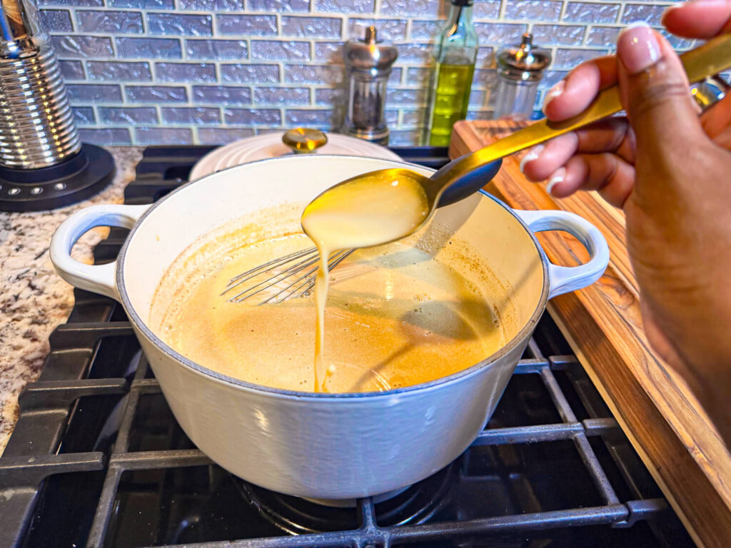 photo of spooning cooked dairy-free eggnog