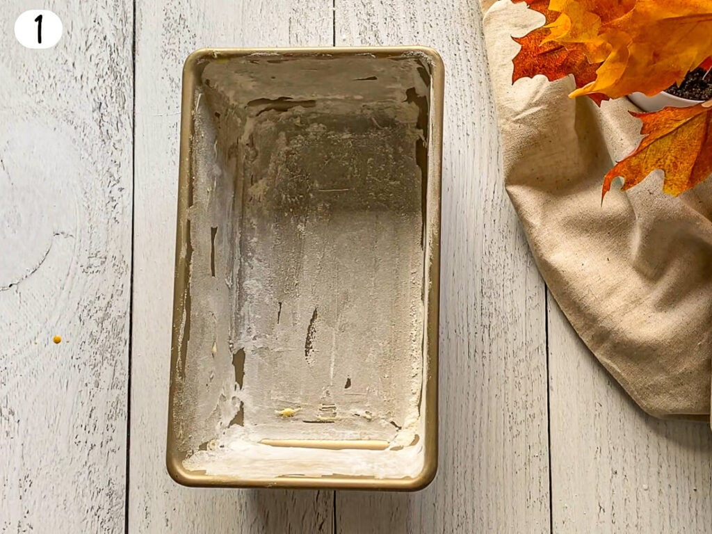 floured bread pan for pumpkin bread