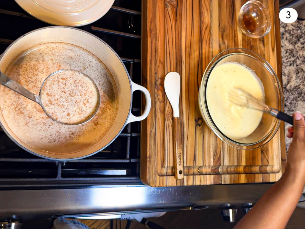 photo of spooning oatmilk coconut milk and spice mixture into egg sugar custard