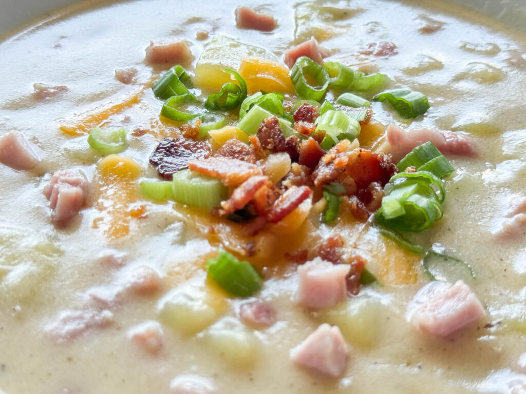 Close up photo of ham and potato soup