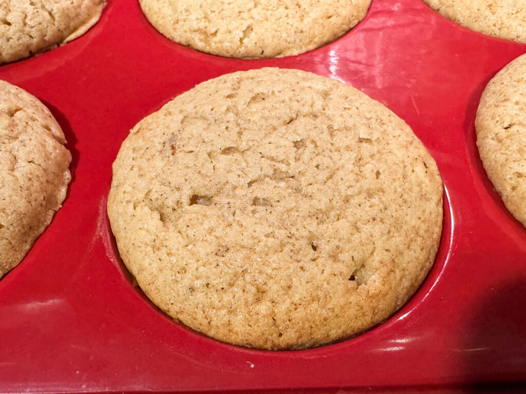 close up photo of a Apple Cider Muffin fresh out of the oven
