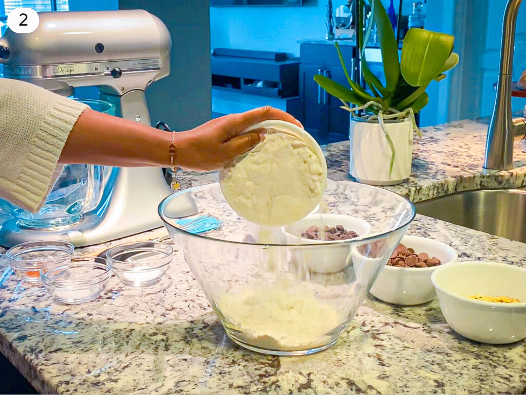 photo of Elicit Folio adding flour to a mixing bowl