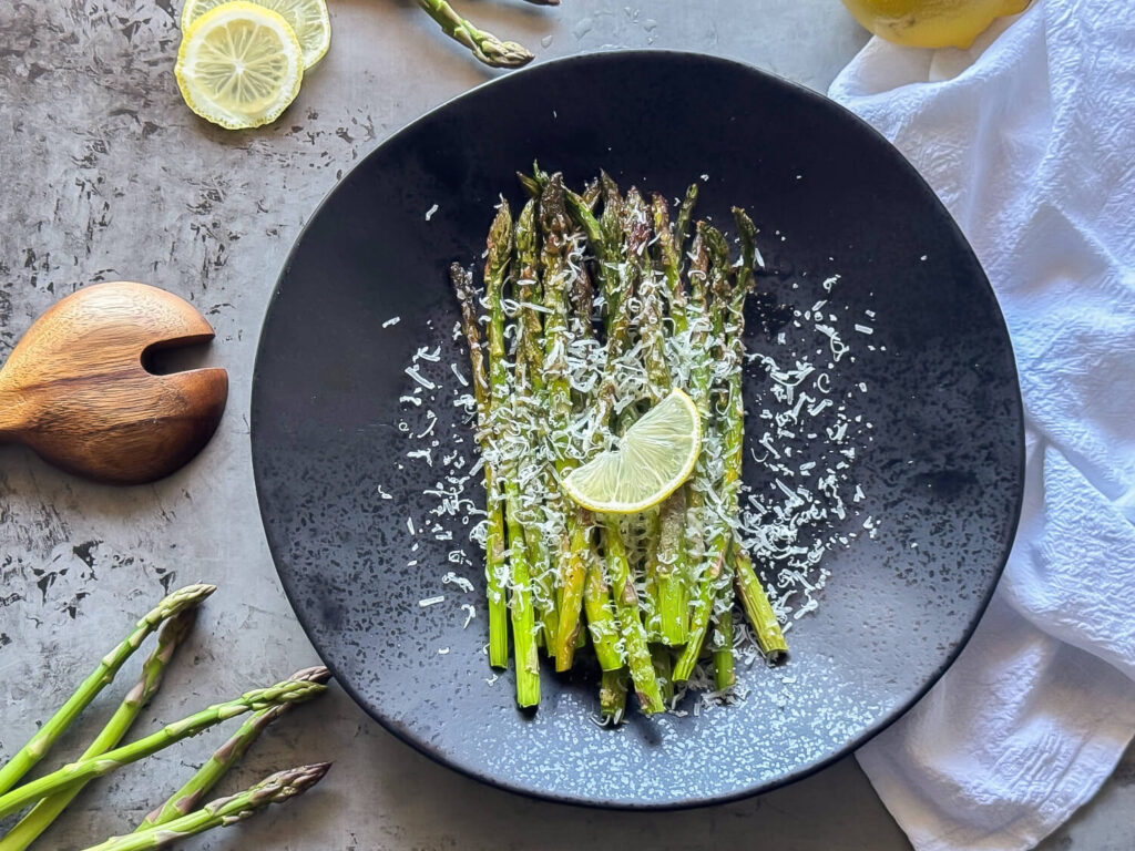 photo of Oven Roasted Asparagus on a black plate