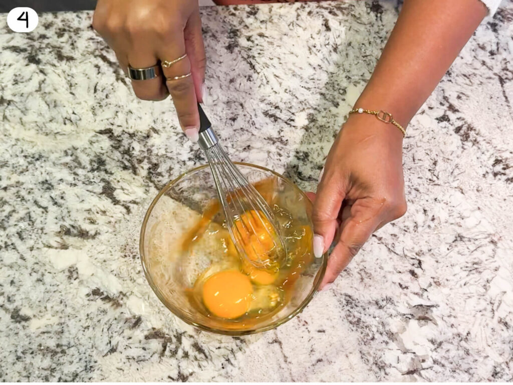 photo of whisking eggs and vanilla together