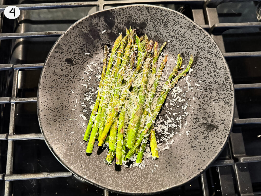 photo of Oven Roasted Asparagus on a black plate