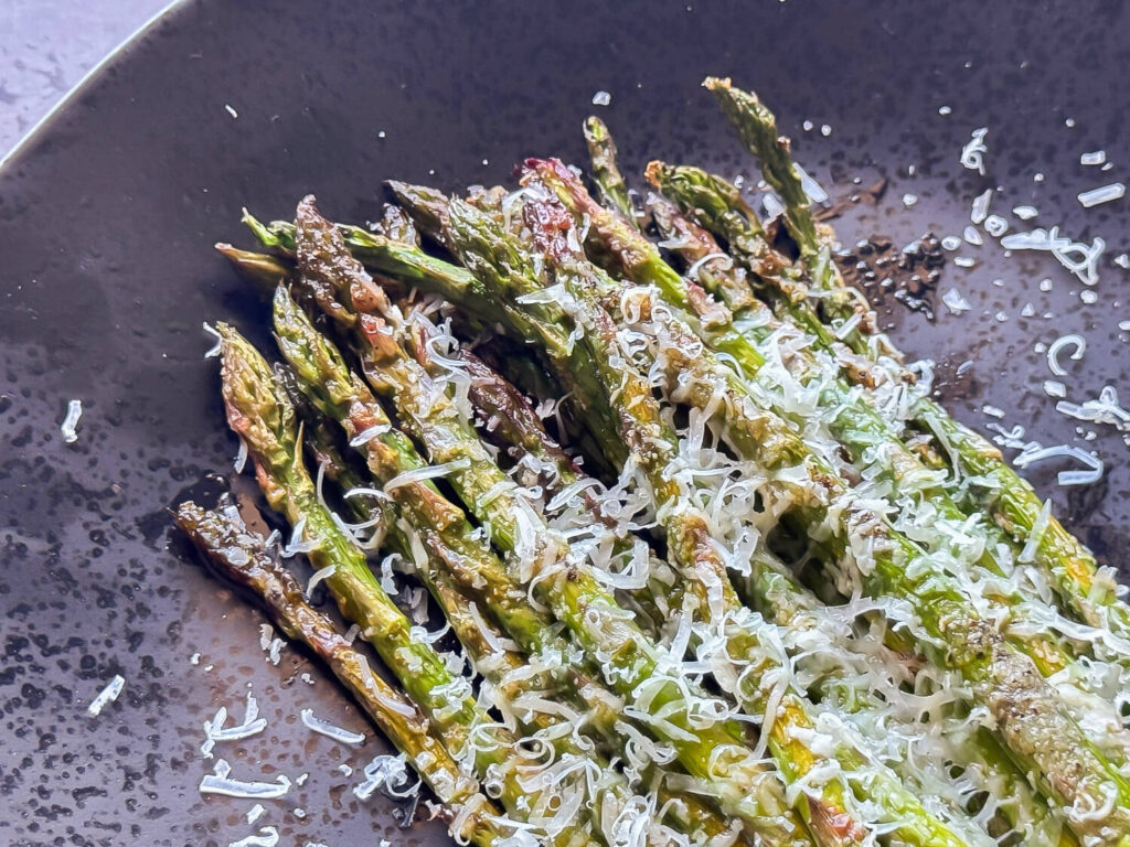 photo of Oven Roasted Asparagus on a black plate