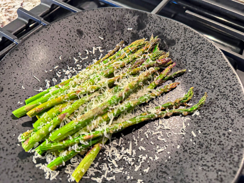photo of Oven Roasted Asparagus on a black plate