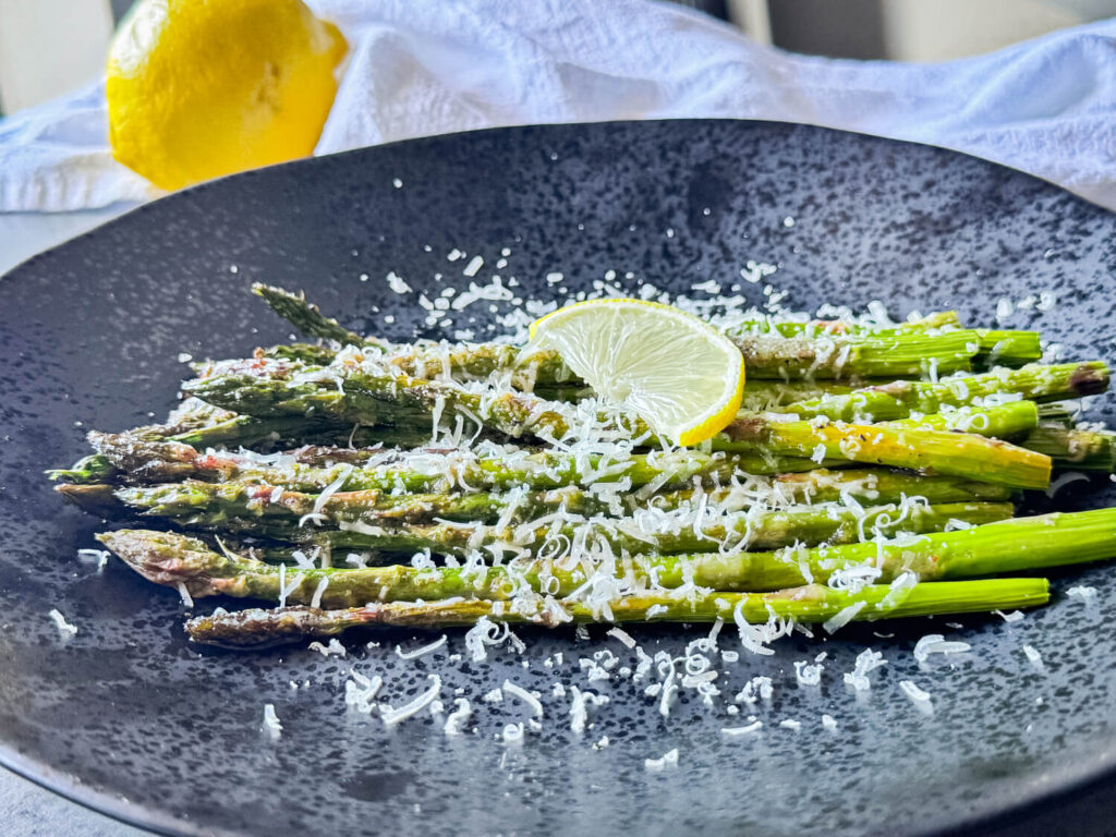 photo of Oven Roasted Asparagus on a black plate