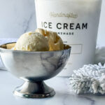 photo of Eggnog Ice Cream in a silver ice cream cup