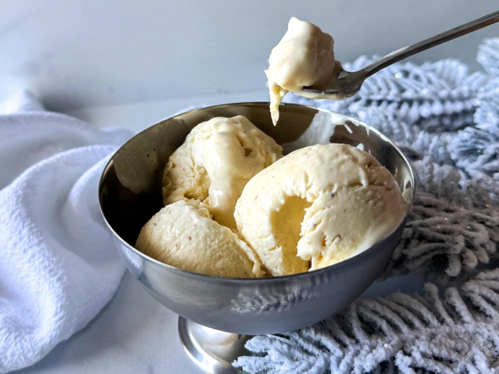 photo of someone scooping Eggnog Ice Cream