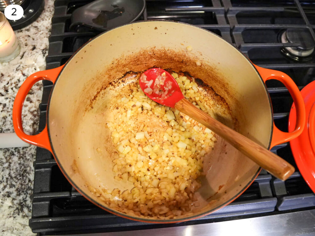 photo of saut&eacute;ed garlic and onions in a dutch oven