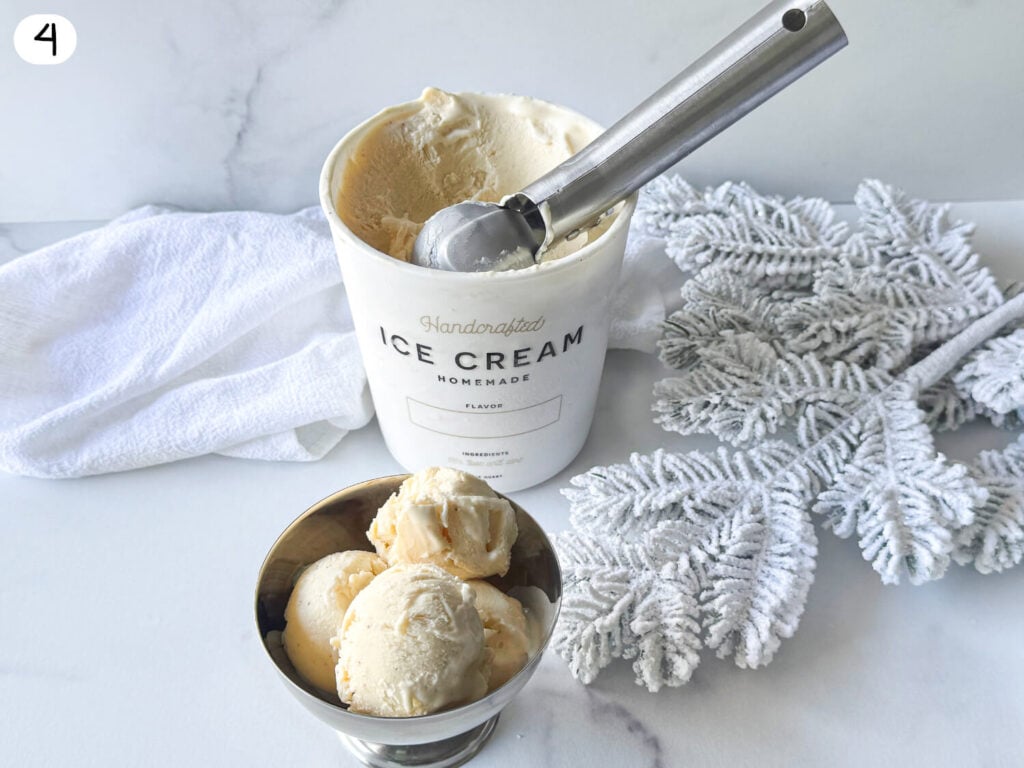 photo of Eggnog Ice Cream in a silver bowl next to a container of Ice Cream