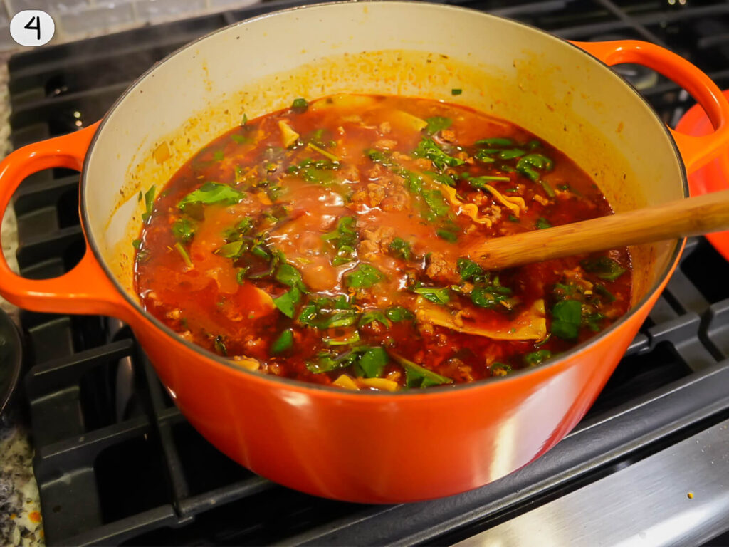 photo of lasagna soup cooking with spinach