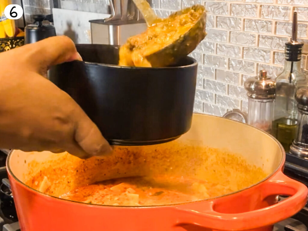 photo of lasagna soup being poured into a bowl