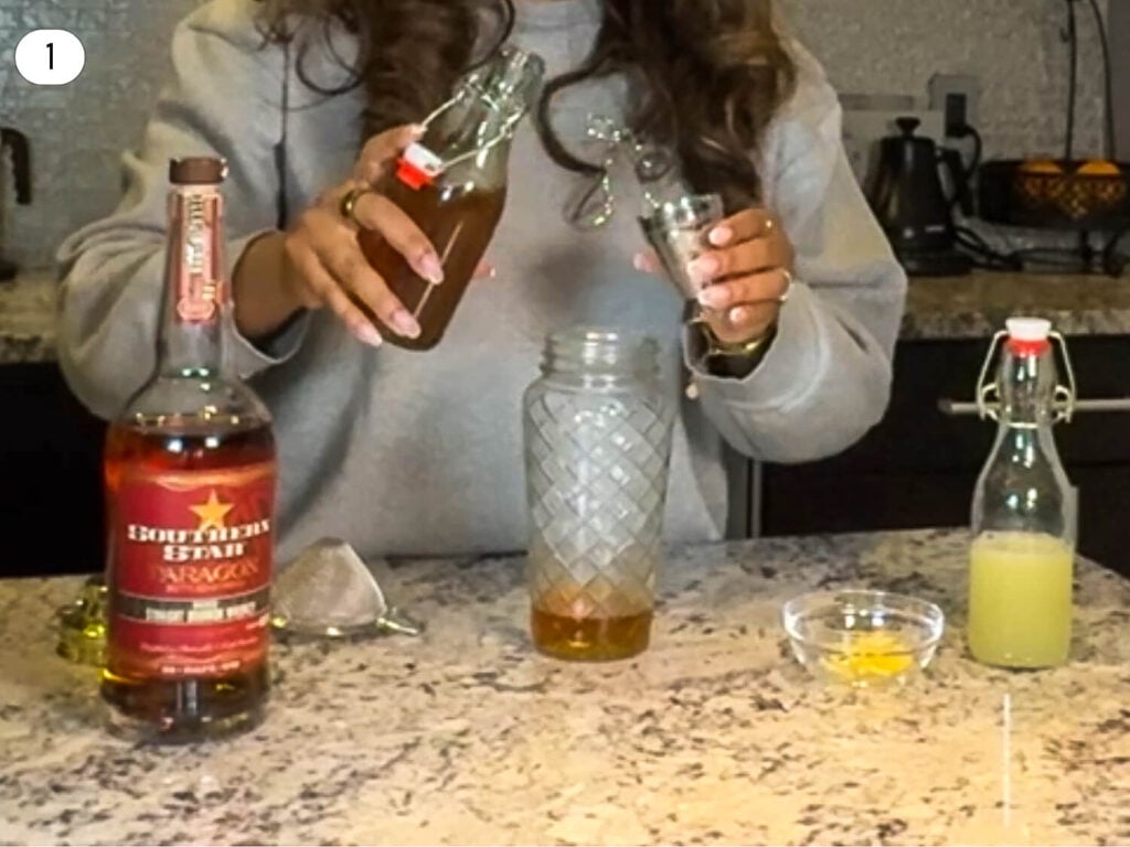 photo of honey syrup being poured into a shaker
