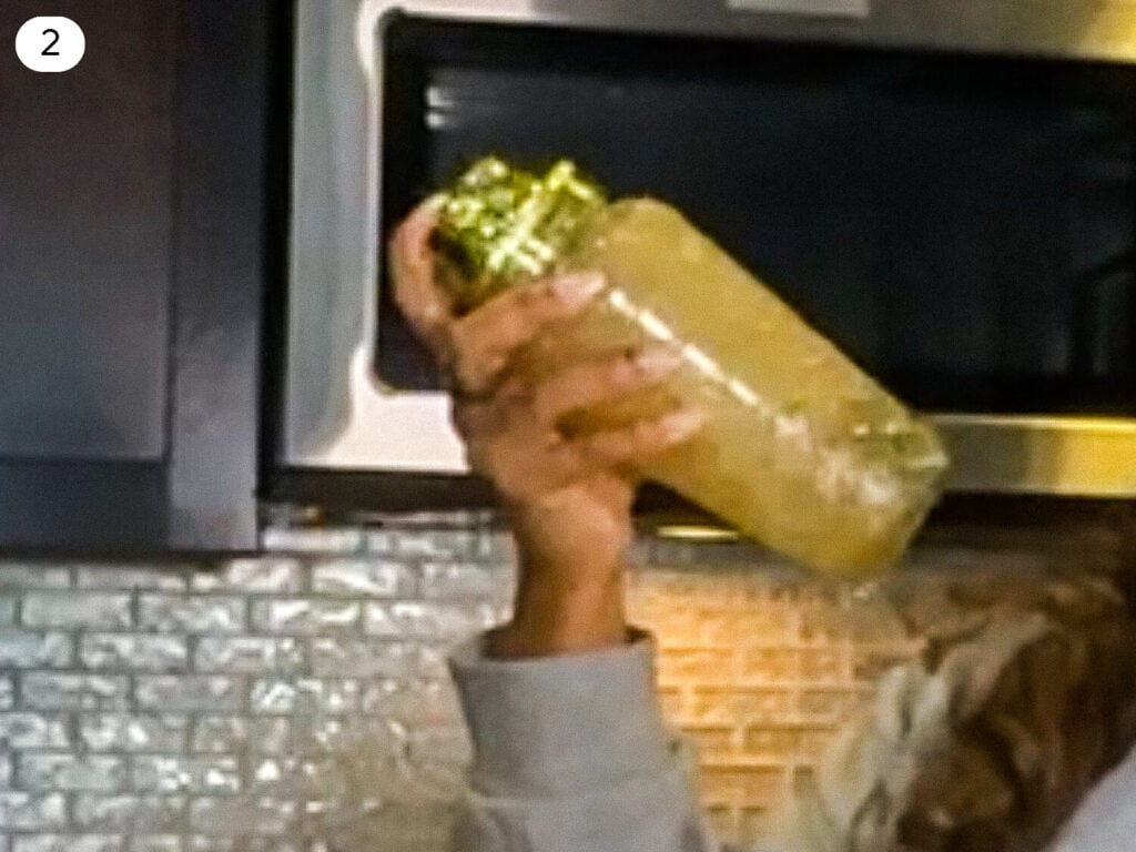 Gold Rush Cocktail being shaken in a cocktail shaker