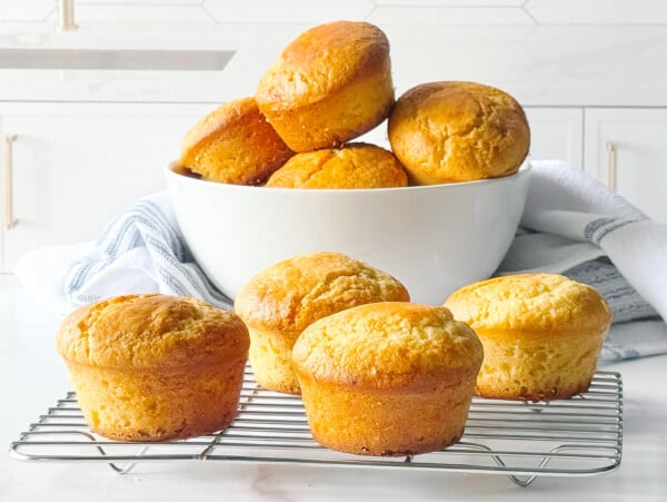photo of Cornbread Muffins stacked in a white bowl