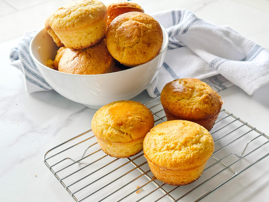 side view of Cornbread Muffins on a wire tray