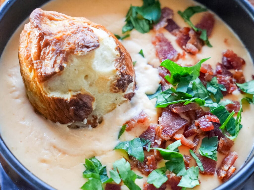 Photo of pretzel and beer cheese in a bowl