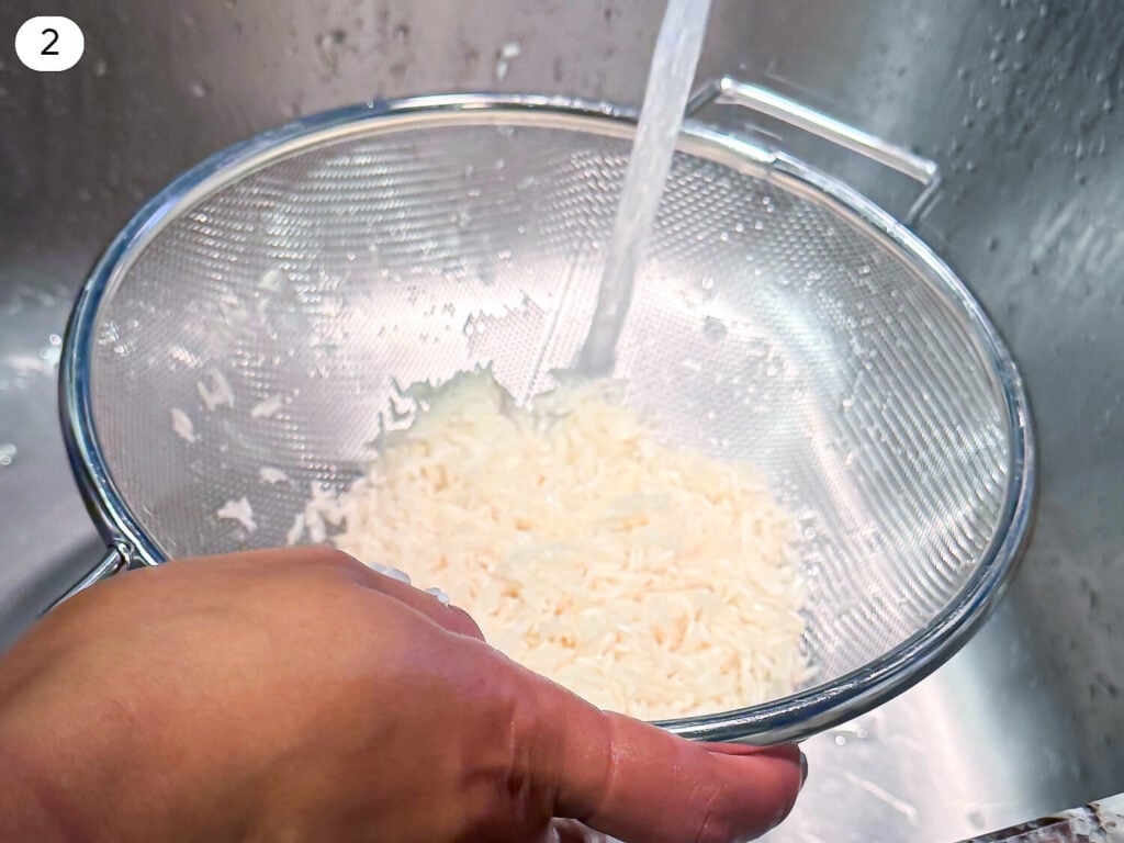 photo of white rice being cleaned before cooking