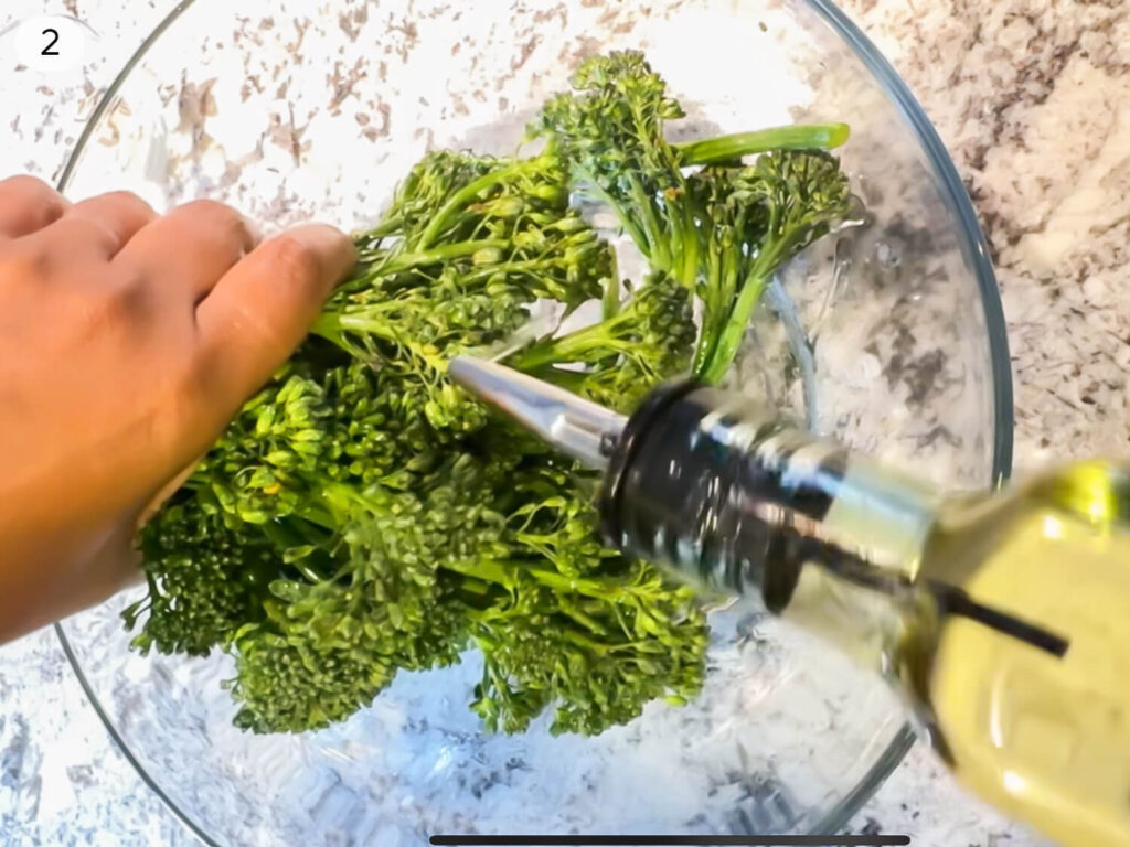 progress photo 2 of drizzling olive oil on top of Broccolini