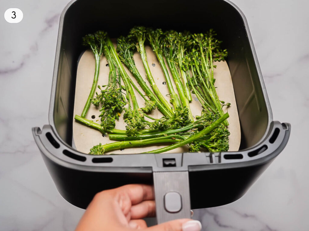 progress photo 3 of Broccolini in an air fryer basket