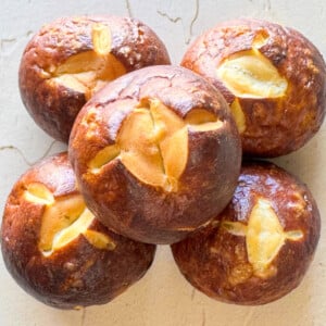 a photo of five pretzel buns stacked