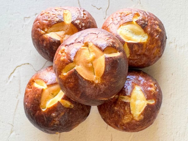 a photo of five pretzel buns stacked