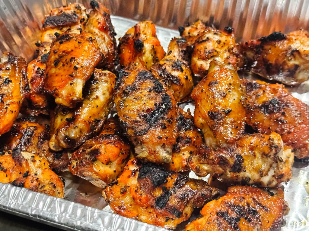 a photo of grilled Chicken Wings in metal pan cooling off of the grill
