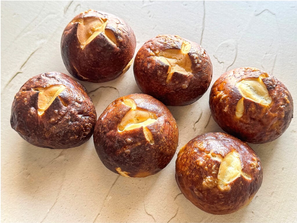 a photo of six pretzel buns