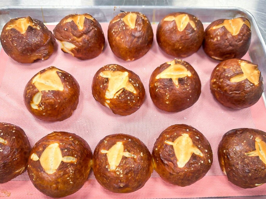 a tray full of pretzel buns from pastry school