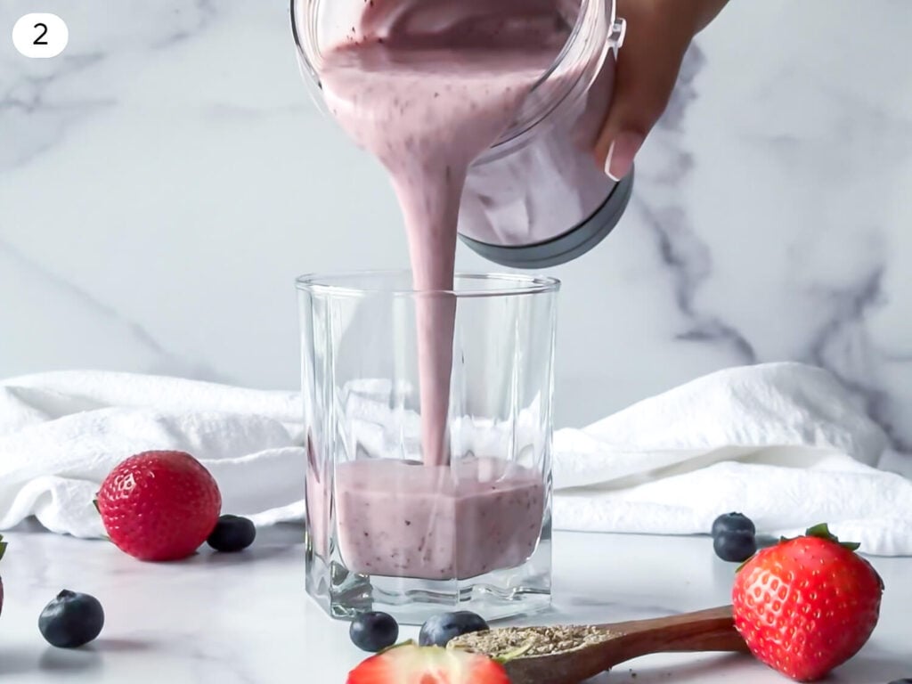 photo of Strawberry Blueberry Smoothie being poured into a glass