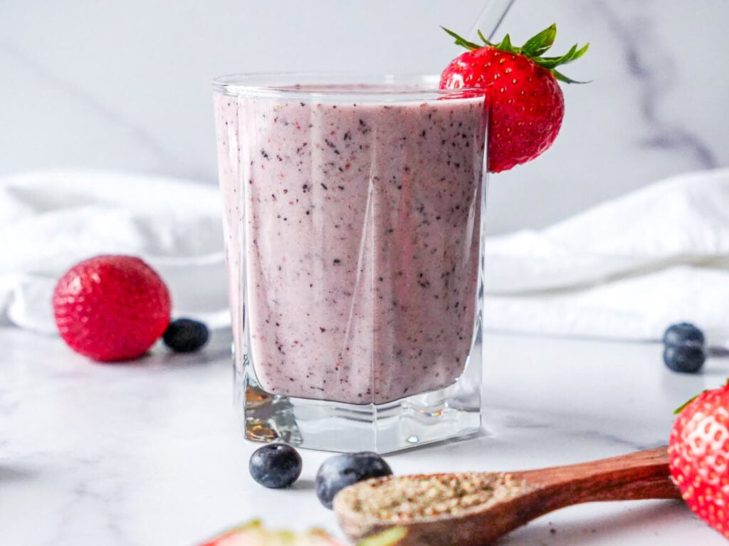 photo of a Strawberry Blueberry Smoothie garnished with a strawberry