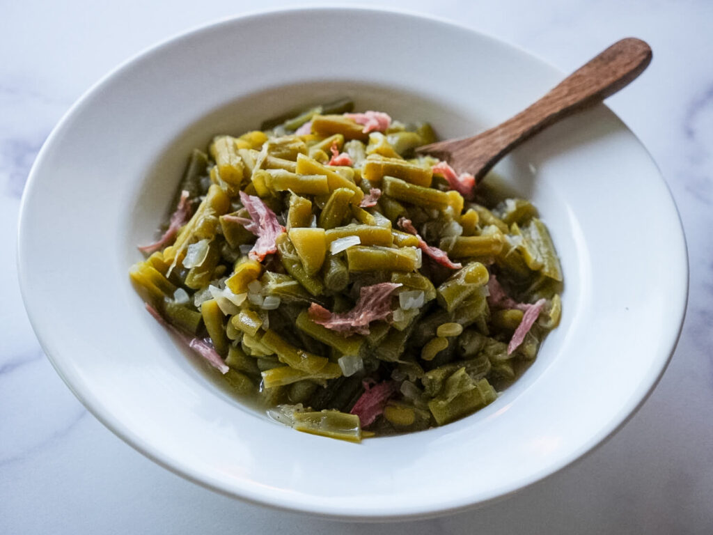 Close up photo of Southern Green Beans in a white bowl
