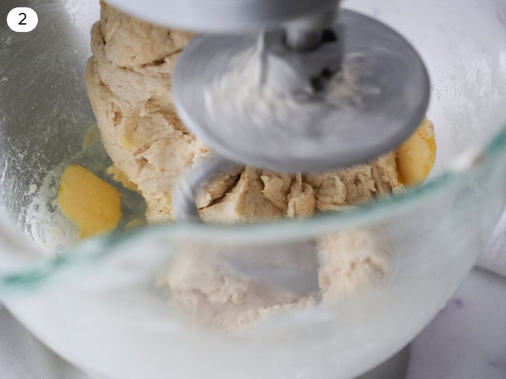 step 2 - photo of flour butter dough coming together in stand mixer